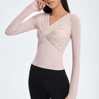 China Cross Folded Ladies Yoga Tops Long Sleeve V Neck Sports Shirts With Thumb Hole for sale