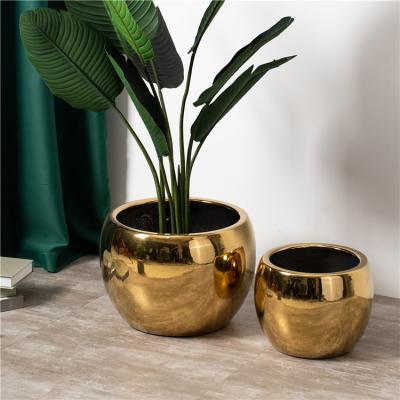 China Creative floor decor large outdoor garden planter round luxury golden ceramic flower pots for balcony for sale