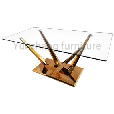 中国 家族の使用のための独特で明確なガラス ダイニング テーブルの金SS201基盤 販売のため
