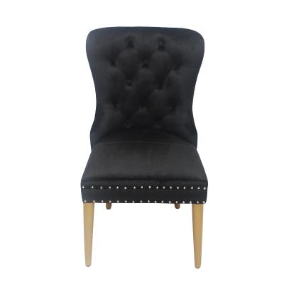 China Silla de terciopelo con hebilla de botón negro silla de comedor modelo elegante en venta