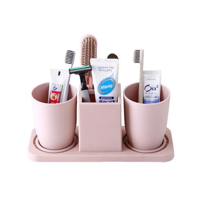 China Toothbrush Holder and Large Toothpaste Stand Organizer Plastic Storage Rack Set Bathroom Accessories for Family, Kids. for sale