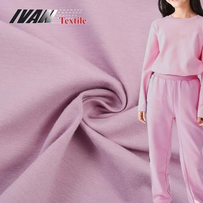 China Sustainable breathable soft eco friendly plain dyed pink cotton spandex knit stretch jersey fabric for kidswear for sale