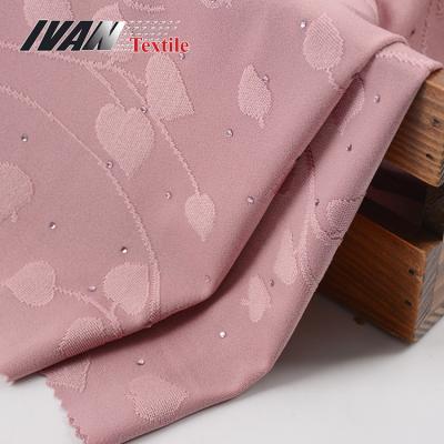 China Luxury new fashion stretch dress knitted DTY spandex jacquard polyester spandex stretch fabric with diamond for sale