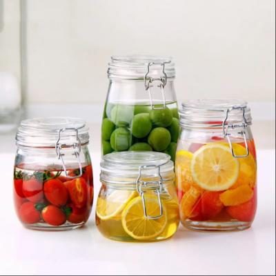 China Stainless Steel Snap Airtight Glass Food Storage Canisters 700ml 500ml for sale