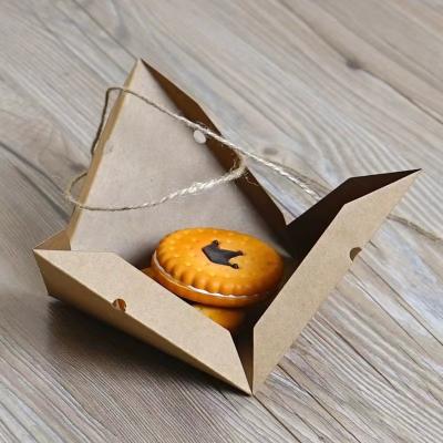 China Kraft paper triangular pyramid, European style biodegradable paper food packaging box, creative pastry box for sale