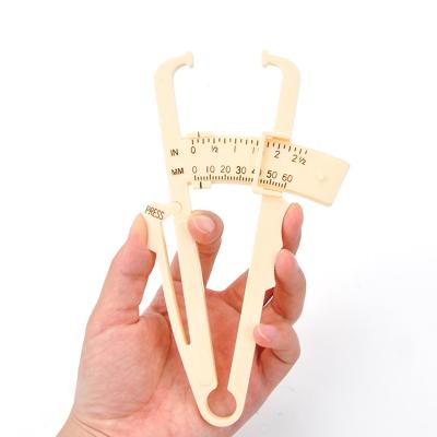 China Manual da calculadora do compasso de calibre da pele da gordura corporal da polegada do centímetro para o agregado familiar à venda