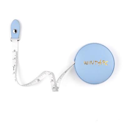 China Wintape Fashion Logotipo de estampado en caliente Forma redonda Multicolor Mini Cute Blue Leather Tape Medida en venta