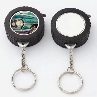 China Custom Logo Auto Tyre Tire Shaped Promotional Gifts Mini Retractable Steel Tape Measure Keychain Measuring Tape à venda