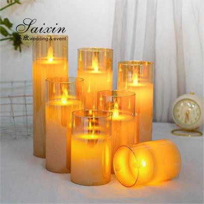 China Hot sale  wedding  decoration real wax flicke moving flame LED pillar candle with glass cups for sale
