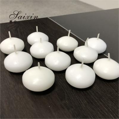 China Hot sale 4.5cm real wax water activated floating candles for wedding decoration centerpiece candle holders à venda