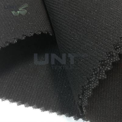 China Tela que interlinea fusible tejida nuevo punto 100% de la deformación de la malla del poliéster para la ropa del uniforme del traje en venta