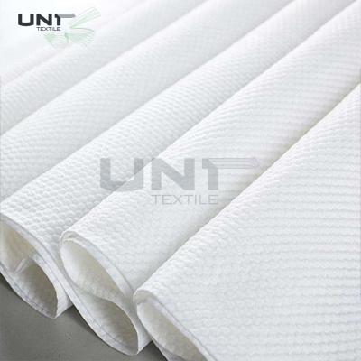 China Pearl Dot Pattern Spunlace Nonwoven Fabric Cross Lapping 10cm Width for sale