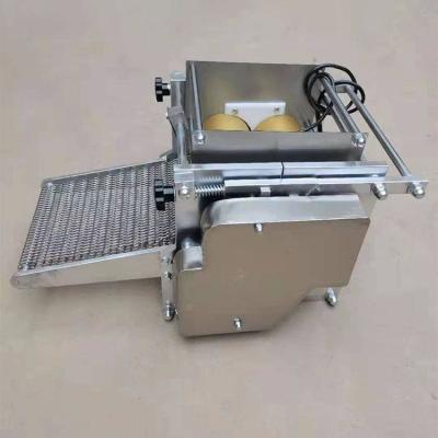 China Fully automatic industrial corn cake making machine for pressing bread and grain products corn cakes Te koop