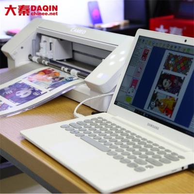 中国 Make Customized Picture Stickers Daqin Cutting Machine For Phone Or Laptop 販売のため