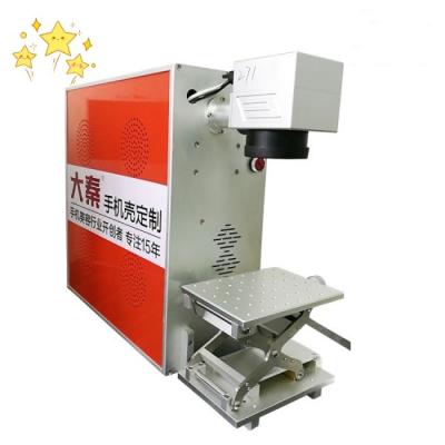 China Máquina del grabador del cortador del laser de la fibra del acero inoxidable del OEM para el caso de la PC en venta