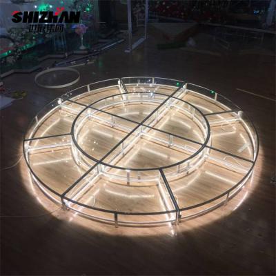 China Large Corporate Event Stage Retractable Acrylic Tempered Glass Lights Round Stage for sale