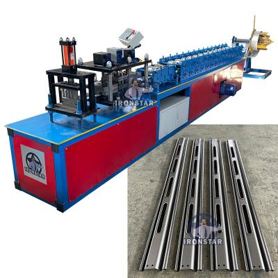 China thickness 0.7-1.2mm Punching Hole Shutter Door Roll Forming Machine 14 rows for sale