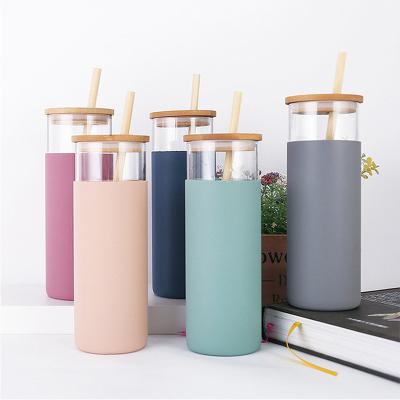 China Nontoxic Silicone Water Bottle Transparent Glass With Silicone Straw Bamboo Lids for sale