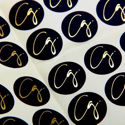 China Black Round Matte Black Paper Sticker Labels With Gold Logo for sale