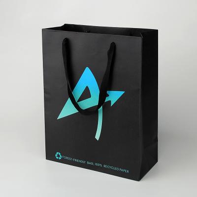 China Black Paper Shopping Bag Black Bag Holographic Logo Printing Retail Bags for sale