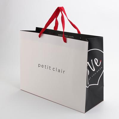 China Paper Bag With Your Own Logo Shopping Packaging Bag With Ribbon Handle for sale