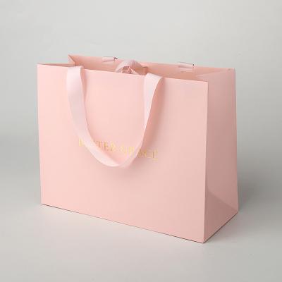 China 200gsm Paper Custom Made Shopping Bags Pink Paper Retail Bags With Ribbon Handle Logo for sale
