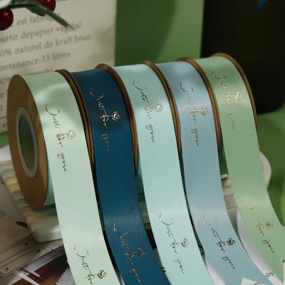 China Customized Gold Foil Printed Polyeater Satin Ribbon for Gift Packing for sale