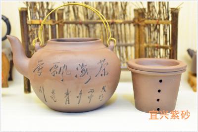 China Handmade Chinese Yixing Zisha Teapot 1000ml With Chinese Words Carving en venta