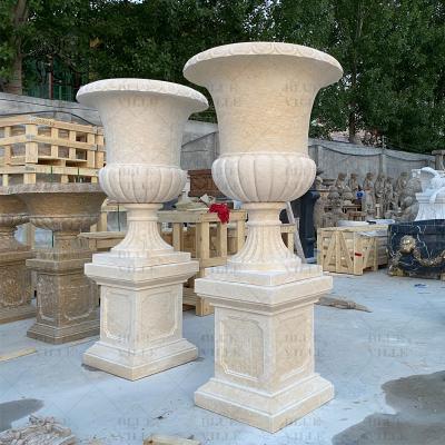 China Beige Marble Flowerpot Natural Stone Travertine Vase Planter Classic Garden Decorative Western Style en venta