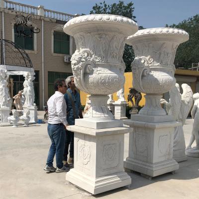 China Large Marble Flowerpot Roman Relief Planters Hand Carved Garden Decoration for sale