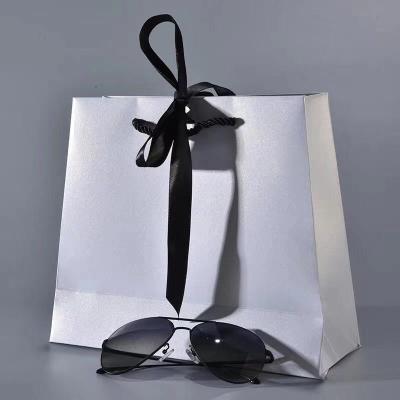 China 100g Matt Laminated Printed Grosgrain Ribbon Handle Paper Shopping Bags for sale