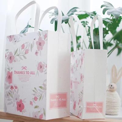 China 32*11*38cm CMYK Color Luxury Kraft Paper Carry Bags for sale
