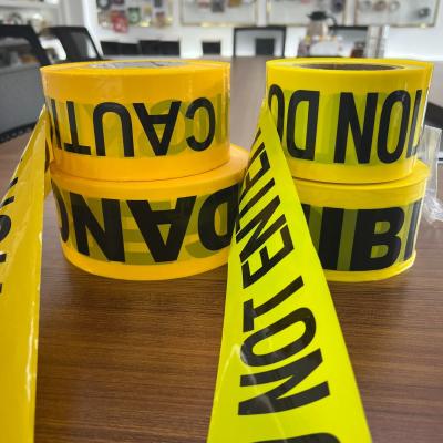 China PE Warning Tape CAUTION Traffic Safety Yellow Background Black Lettering Printed Non Adhesive Label Warning Isolation for sale
