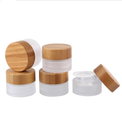 China 5 To 15ml Cosmetic Frosted Glass Jar With Wooden Cap for sale