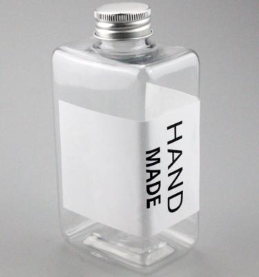 China Botellas plásticas claras de la bebida de Juic del cuadrado con la impresión de pantalla de seda del ODM de las tapas PETG en venta