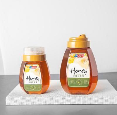 China 0.7L Plastic Honey Bottles Reflux Inlet Sealing Jars Hot Stamping for sale