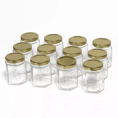 China garrafas de vidro do armazenamento do hexágono do polígono 730ml gravadas para Chili Sauce Pickle à venda