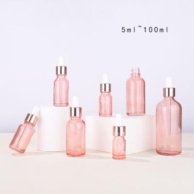 China Round Glass Cosmetic Containers Pink Dropper Bottle 10ml To 100ml for sale