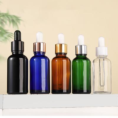 China Hair Oil Glass Cosmetic Containers Rose Gold Dropper Bottle Transparent OEM for sale