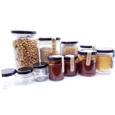 China Eco 25ml 50ml Jam Glass Preserve Jars Clear Glass Canisters With Black Lids for sale