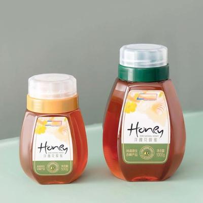 China 300g 500g 1000g Honey Bottles Reflux Inlet Sealing Plastic Seasoning Bottles for sale