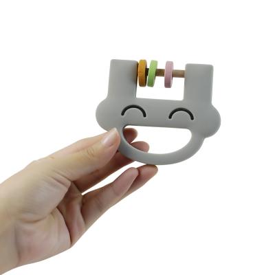Chine Le hochet mignon Teether de silicone de jouets d'enfants de silicone de visage de sourire avec adaptent l'ODM aux besoins du client d'OEM de logo à vendre