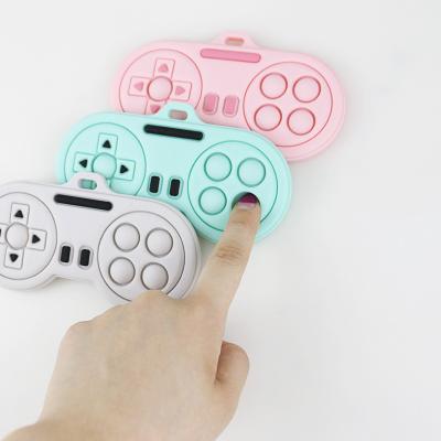 China Baby Teething Products - Washable Various Colors custom cute cartoon player controller shape silicone teethers toys à venda