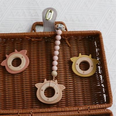 China Multifunctional Silicone Baby Teether With Attachable Teething Wooden Ring Animal Pattern for sale