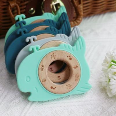 China Dentes de bebê de silicone livre de BPA com anel de madeira - alívio de dentição para bebês, fácil de limpar e durável à venda