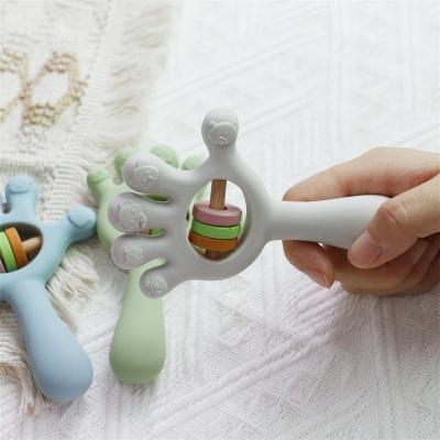 Cina Soft Baby Silicone Teething Rattle Palm hand shape Toys: BPA-Free, Non-Toxic, Chewable in vendita