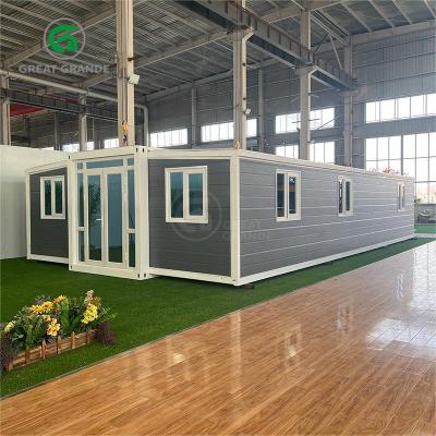 China 40ft Expandable Container Shelter White Frame Gray Wall Panel Broken Bridge Aluminum Door for sale
