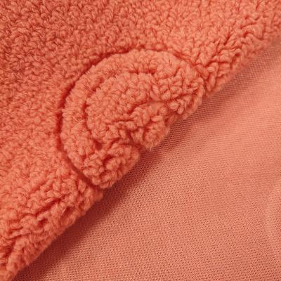 China 100% Polyester Sherpa Fabric Textile Warp Knitted Smilling Face Pattern Embossed for sale