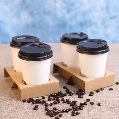 中国 使い捨て可能コーヒー カップのキャリアのクラフト紙のコップのパッキングのための熱い飲み物のホールダーを波形を付けて下さい 販売のため