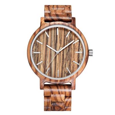 China Reloj de madera grabado mano de la cebra en venta